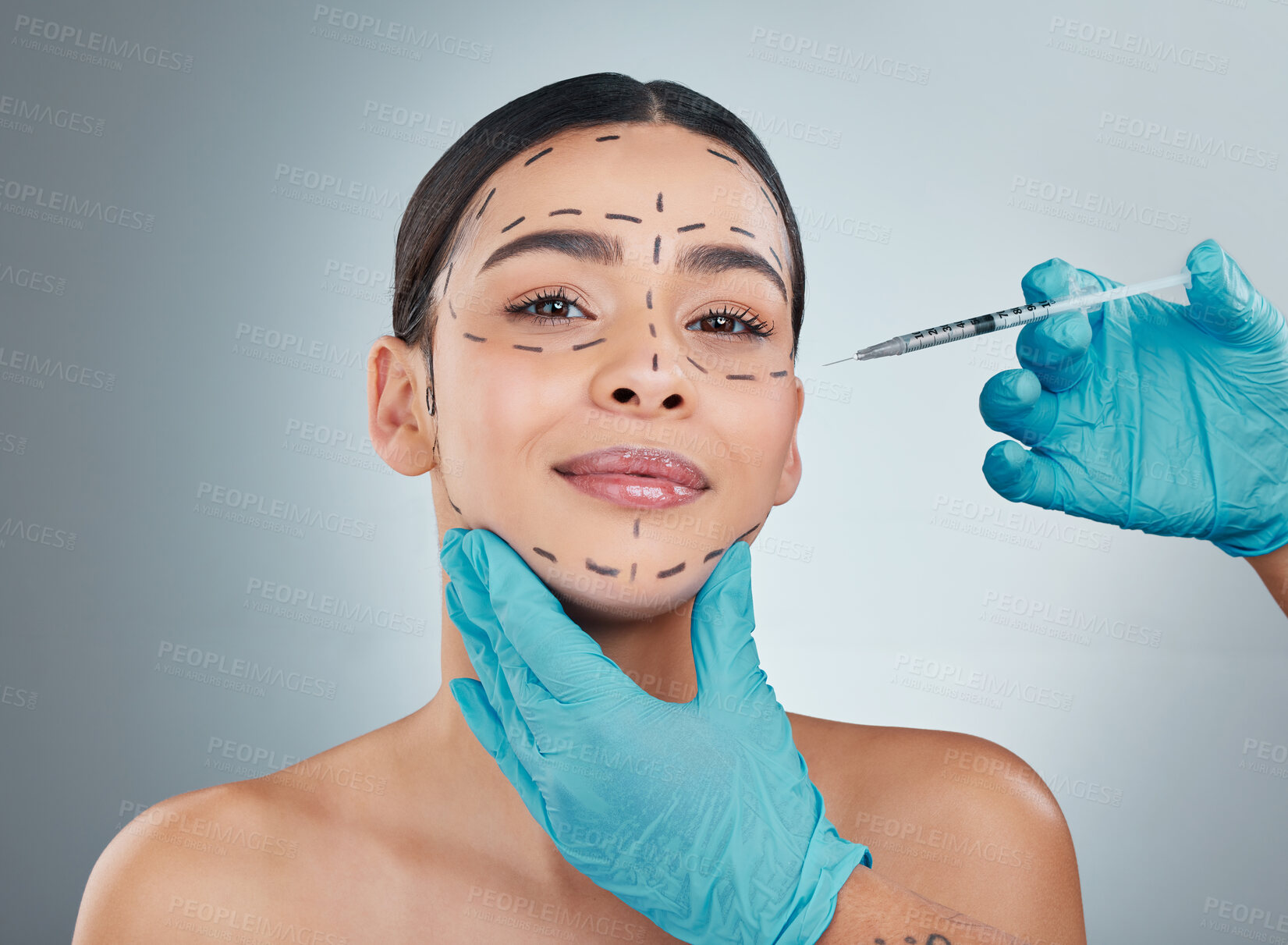 Buy stock photo Portrait, plastic surgery and injection with a woman in studio on a gray background for a facelift. Doctor, medical and improvement with hands in gloves holding a syringe for facial collagen