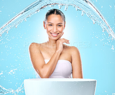 Buy stock photo Portrait, smile model and woman with water, skincare and hygiene for wellness and routine by basin. Face, stream splash and washing for health hydration, happy by studio blue background and cleaning