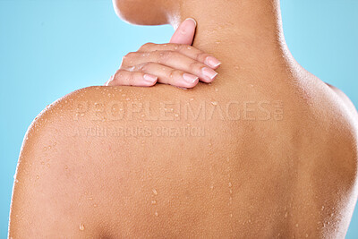 Buy stock photo Studio shot of a woman posing with water droplets on her back