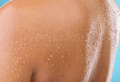 Buy stock photo Studio shot of a woman posing with water droplets on her back