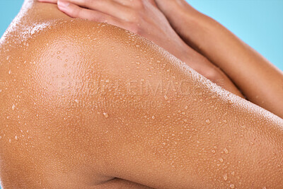 Buy stock photo Studio shot of a woman posing with water droplets on her skin