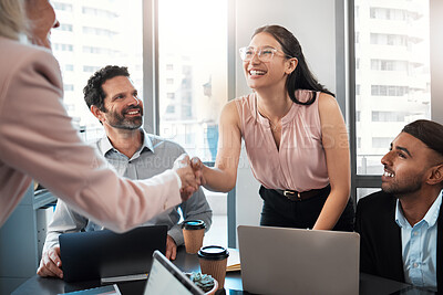 Buy stock photo Shot of a young businesswoman shaking hands with a colleague during a meeting in the office
