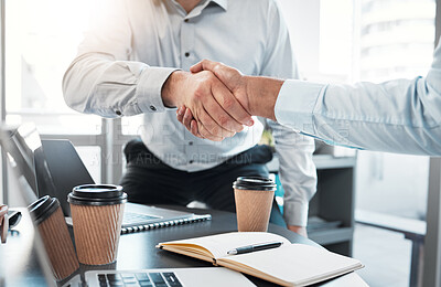 Buy stock photo Cropped shot of an unrecognisable businessman shaking hands with a colleague during a meeting in the office