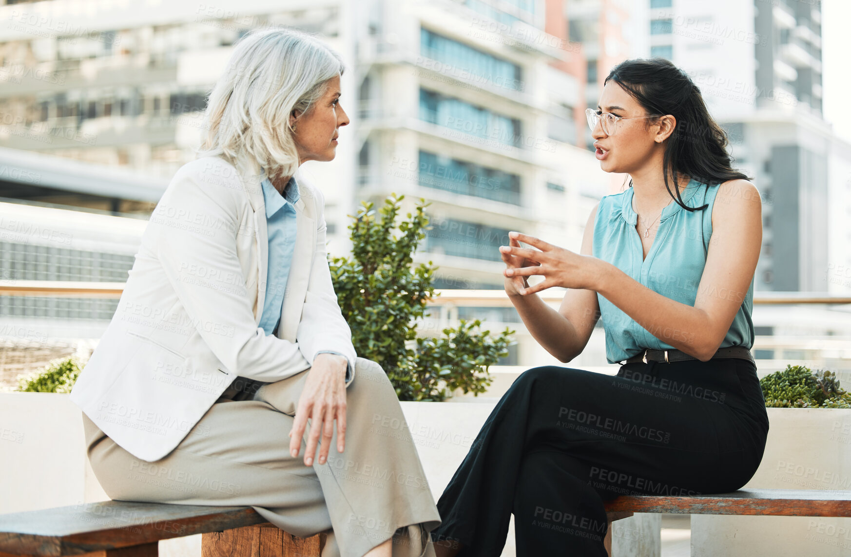 Buy stock photo Business, women and meeting at office balcony for strategy, brainstorming and planning in France. Outdoor, people and employees in conversation with teamwork or collaboration and property developers