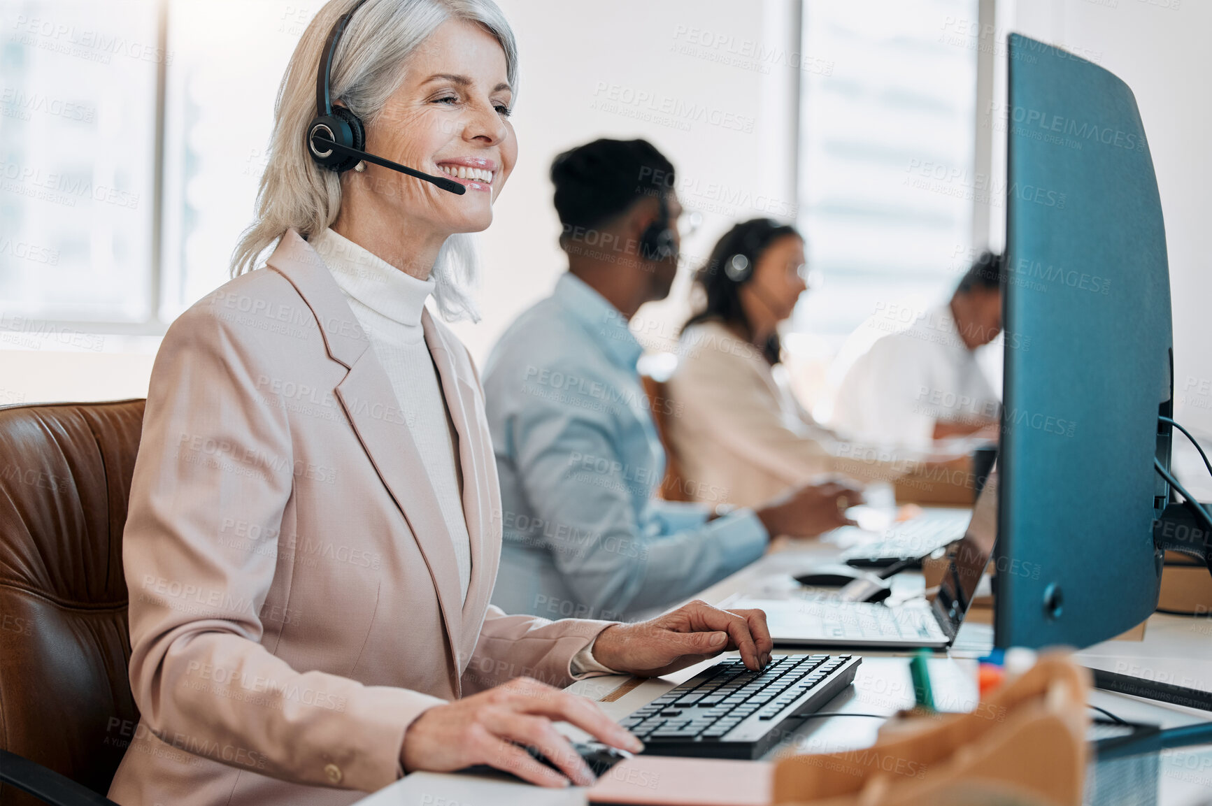 Buy stock photo Mature woman, happy and computer at call center with reading, advice or solution with customer service. Person, agent and crm with typing, mic and help desk with contact us for tech support at agency