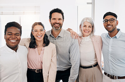 Buy stock photo Shot of a diverse group of businesspeople standing in the office during the day