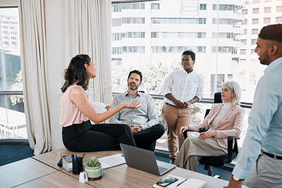 Buy stock photo Shot of a diverse group of businesspeople having a discussion in the office