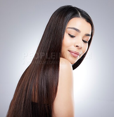 Buy stock photo Studio shot of an attractive young woman posing against a grey background