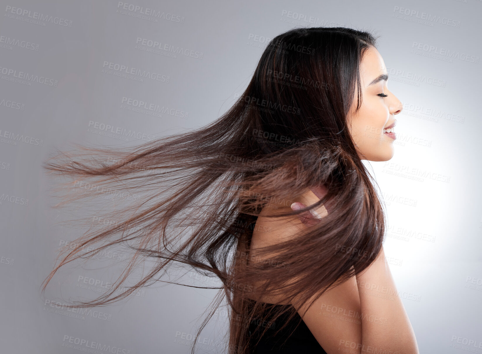 Buy stock photo Studio shot of an attractive young woman posing against a grey background