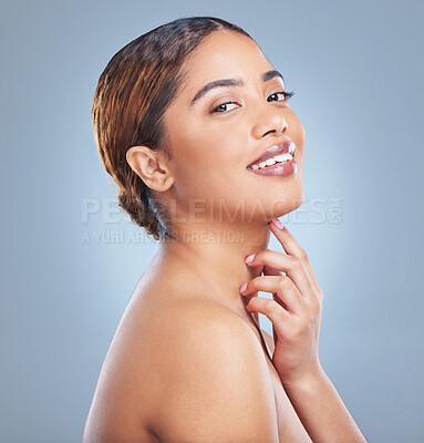Buy stock photo Shot of a young woman standing against a grey background