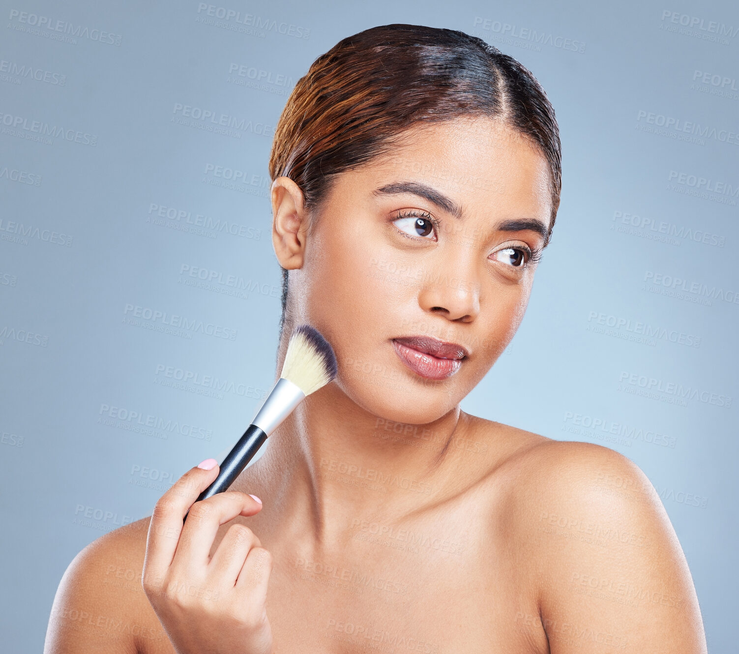 Buy stock photo Woman, makeup and brush in studio with cosmetics, foundation and transformation for self care. Skin, product and face glow or shine for beauty, facial or wellness with confidence as tutorial in spa