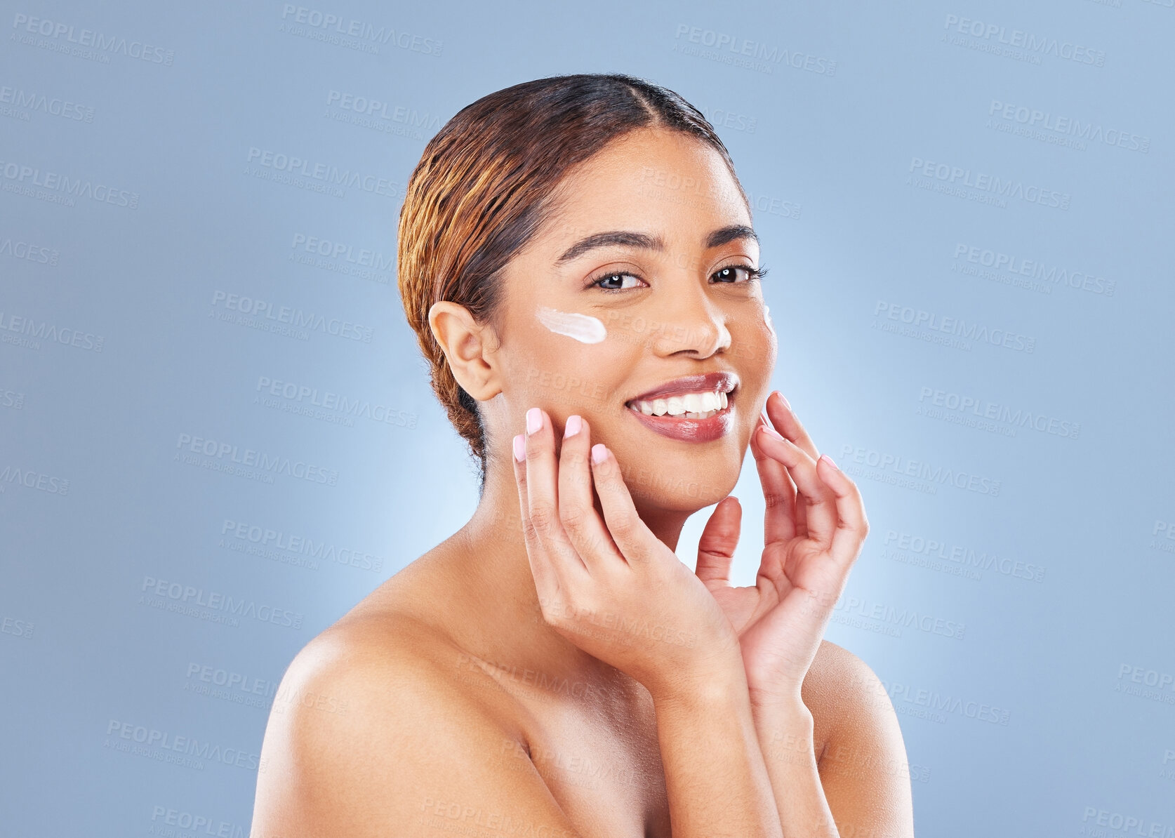 Buy stock photo Portrait, cream or woman with skincare, cosmetics or dermatology on blue studio background. Face, person or model with clear skin, creme or lotion for beauty, grooming routine or treatment with smile