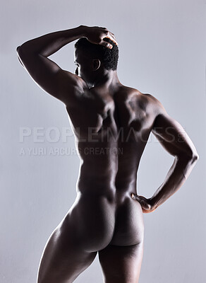 Buy stock photo Shot of an unrecognizable  muscular man posing nude against a grey background