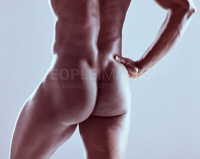 Buy stock photo Shot of an unrecognizable  muscular man posing nude against a grey background