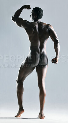 Buy stock photo Shot of an unrecognizable  muscular man posing nude against a grey background