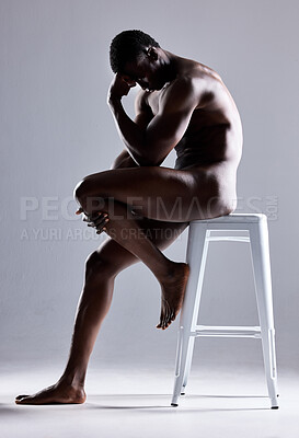 Buy stock photo Shot of a muscular young man posing nude against a grey background