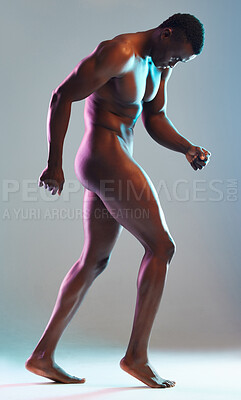 Buy stock photo Shot of a muscular young man posing nude against a grey background