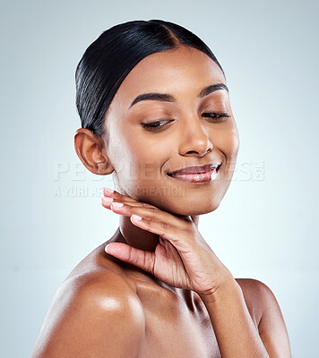 Buy stock photo Cropped shot of an attractive young woman posing in studio against a grey background