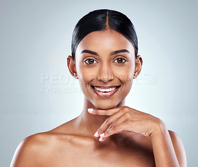 Buy stock photo Smile, beauty and Indian woman or model with skincare cosmetic isolated in a studio white background. Clean, natural and portrait of female person hand on her face happy for self love or care