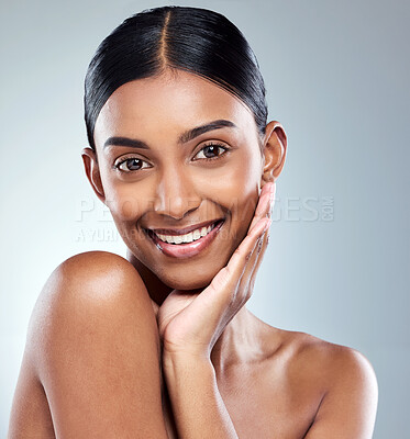 Buy stock photo Smile, portrait and Indian woman beauty or model with skincare cosmetic isolated in a studio white background. Clean, natural and female person hand on face happy for self love, care or dermatology