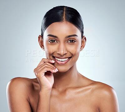 Buy stock photo Smile, portrait and skincare of Indian woman or model with dermatology cosmetics isolated in a studio white background. Clean, natural and female person hand on her face happy for self love or care