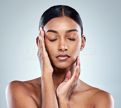 Buy stock photo Beauty, makeup and face of Indian woman on a white background for cosmetics, wellness and skincare. Dermatology, cosmetology and person with hands for health, salon and facial treatment in studio