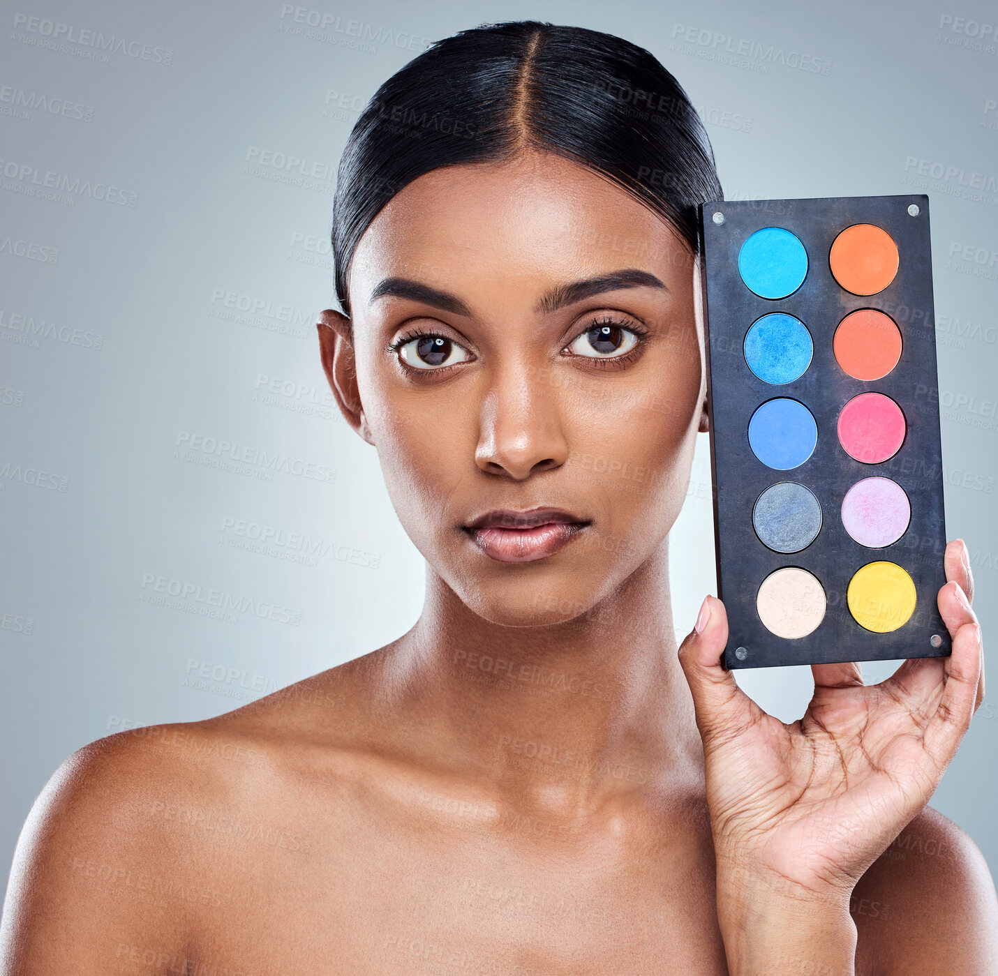 Buy stock photo Beauty, makeup palette and woman with portrait in studio for cosmetics, powder or foundation on gray background. Face, skincare and model with cosmetology product, facial glow and eyeshadow