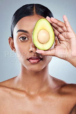 Buy stock photo Portrait, woman and avocado in studio for clean beauty, natural skincare and wellness or diet. Fruit, model girl and nutrition or health by white background with food for facial, glow and omega 3