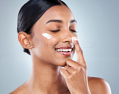 Buy stock photo Nose, skincare and Indian woman with hand and cream, beauty and studio on white background. Collagen, dermatology or smile for female person or selfcare, hydration and cosmetology or retinol product