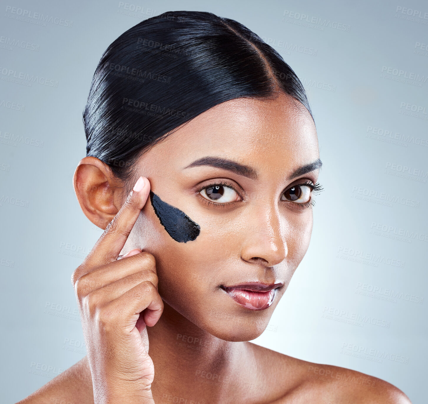 Buy stock photo Charcoal, skincare or portrait of woman with face mask application in studio for dermatology, repair and acne treatment on grey background. Beauty, detox or model with facial product for glowing skin