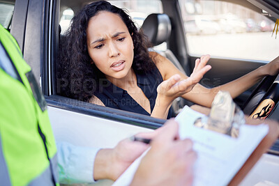 Buy stock photo Shot of a young businesswoman looking upset at receiving a ticket from a traffic officer