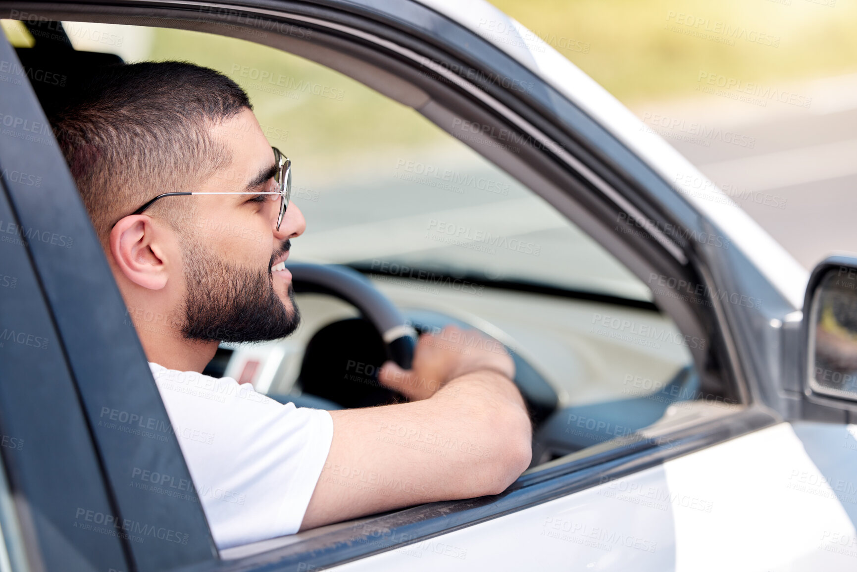 Buy stock photo Happy man, car and driving for road trip, travel or outdoor adventure in the countryside. Young male person or driver smile in vehicle for transportation, journey or vacation on countryside street