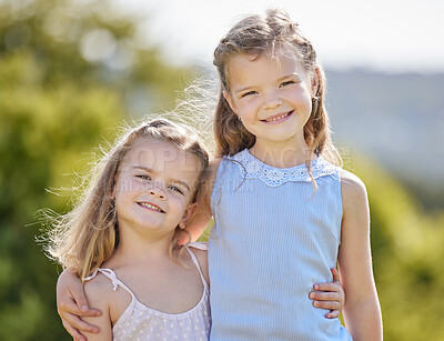 Buy stock photo Shot of two adorable little girls having fun in a park