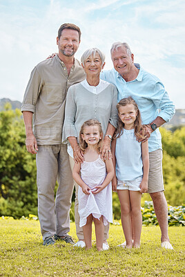 Buy stock photo Shot of a family standing together in a park