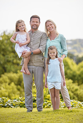 Buy stock photo Portrait, mom and dad in park with kids, smile and outdoor bonding on weekend morning together. Mother, father and girl children in garden for happy family support, relax and love on grass in nature