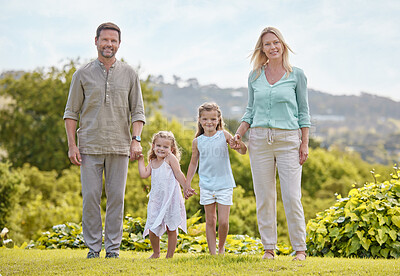 Buy stock photo Portrait, parents and kids in park with holding hands, smile and outdoor bonding on weekend morning together. Mother, father and girl children in garden for happy family fun, relax and love in nature