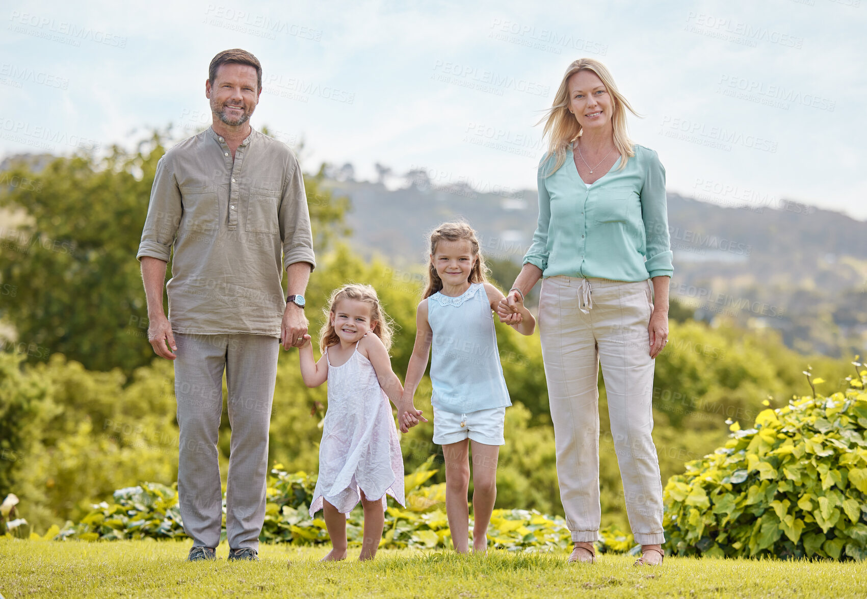 Buy stock photo Portrait, parents and kids in park with holding hands, smile and outdoor bonding on weekend morning together. Mother, father and girl children in garden for happy family fun, relax and love in nature