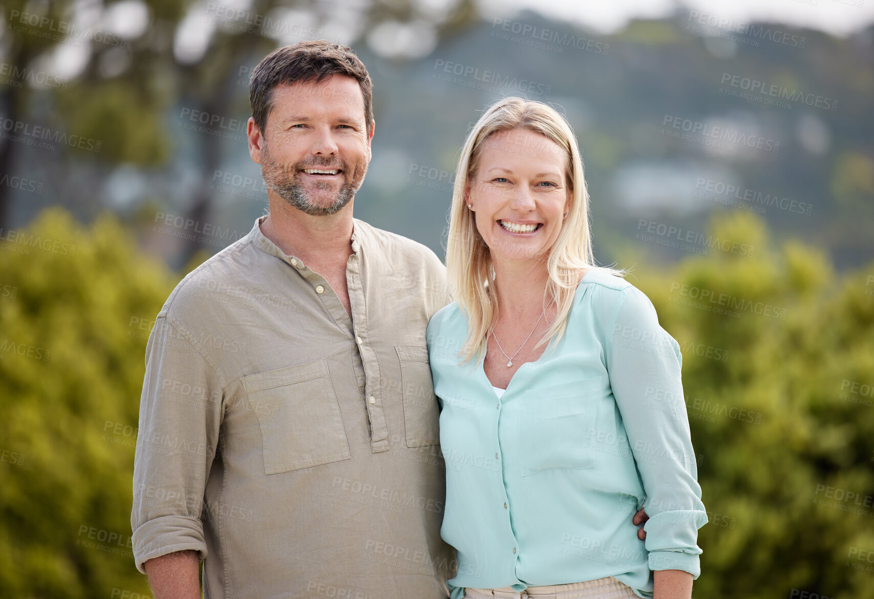 Buy stock photo Happy, nature and portrait of couple hugging on romantic date outdoor in park with care together. Love, smile and mature man and woman in garden by trees on weekend trip or vacation in Australia.