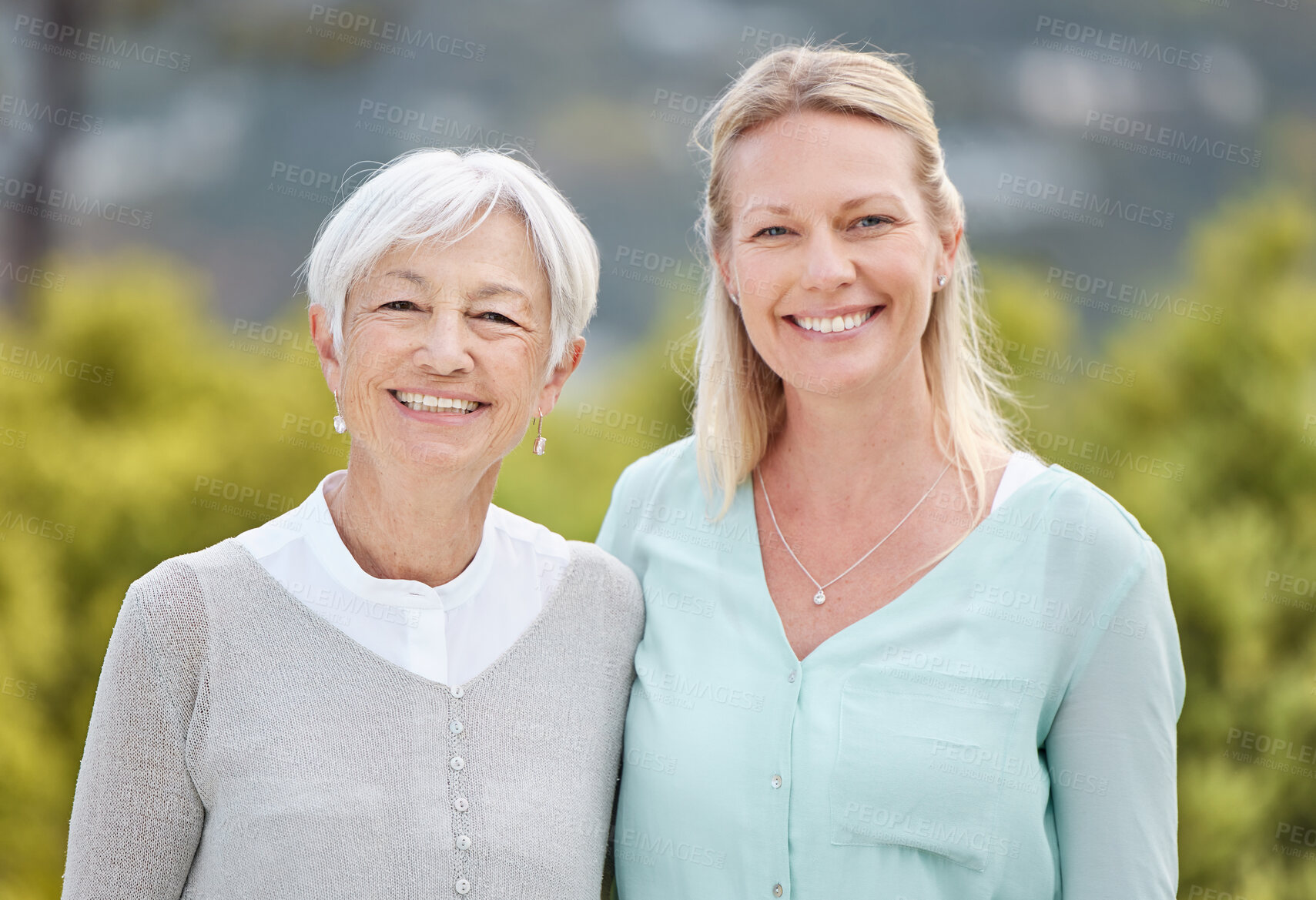 Buy stock photo Happy, portrait and women with senior mother, daughter and hug in nature, park and summer for holiday. Smile, love and mom embracing lady with care for vacation, adventure or weekend break for family