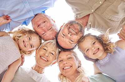 Buy stock photo Shot of a family of four standing together in a huddle