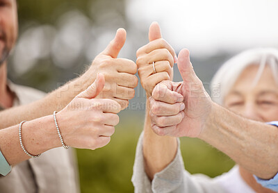 Buy stock photo Shot of a unrecognizable family showing thumbs up outside