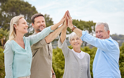 Buy stock photo Shot of a family giving each other a high five in the garden at home