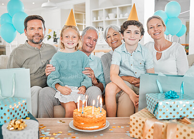 Buy stock photo Cropped portrait of a happy family celebrating a birthday together at home