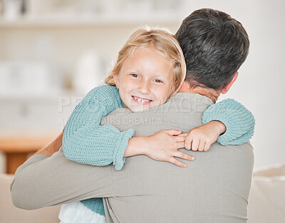 Buy stock photo Cropped portrait of an adorable little girl embracing her mom lovingly at home