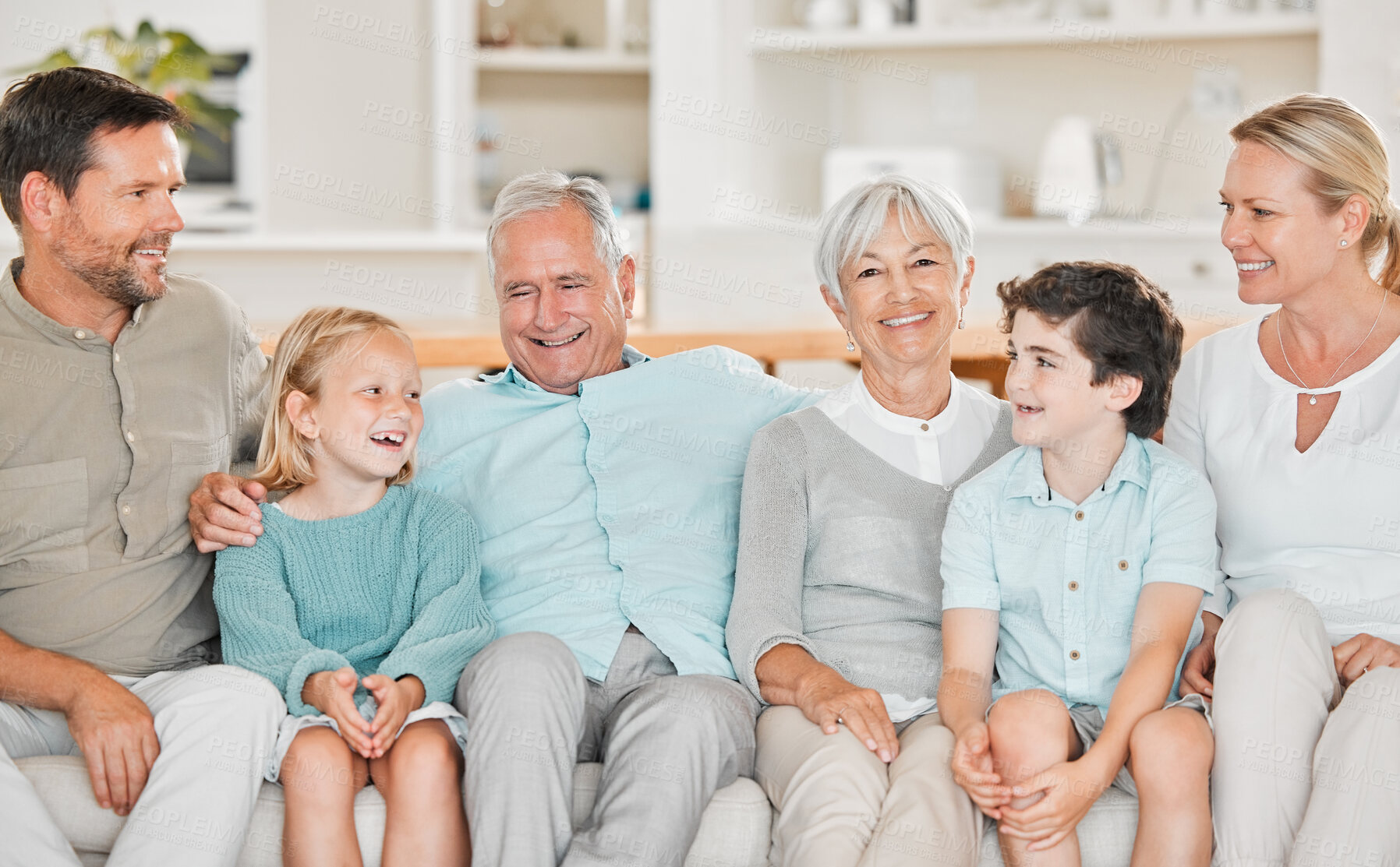 Buy stock photo Big family, senior people and children on sofa with love, positive and care for bonding in home. Grandparents, woman and man in living room for happiness, connection and affection in house together