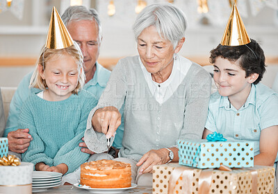 Buy stock photo Cropped shot of two adorable little kids celebrating a birthday at home with their grandparents