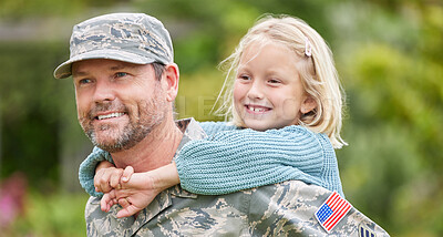 Buy stock photo Shot of a father carrying his daughter on his back outside