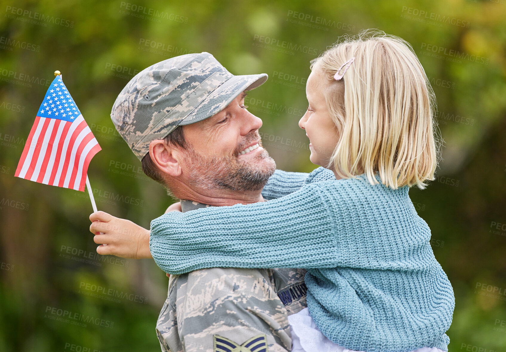 Buy stock photo Shot of a father returning from the army hugging his daughter outside