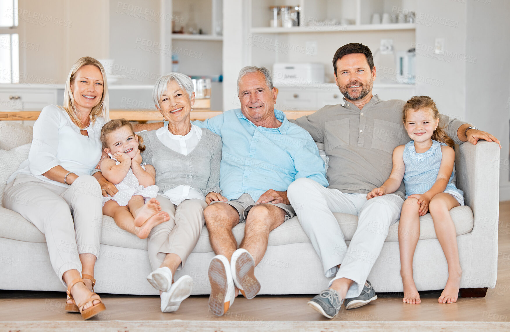 Buy stock photo Generations, portrait and smile of family on sofa in living room of home for bonding or visit. Happy, love or smile with children, parents and senior people in apartment together for retirement