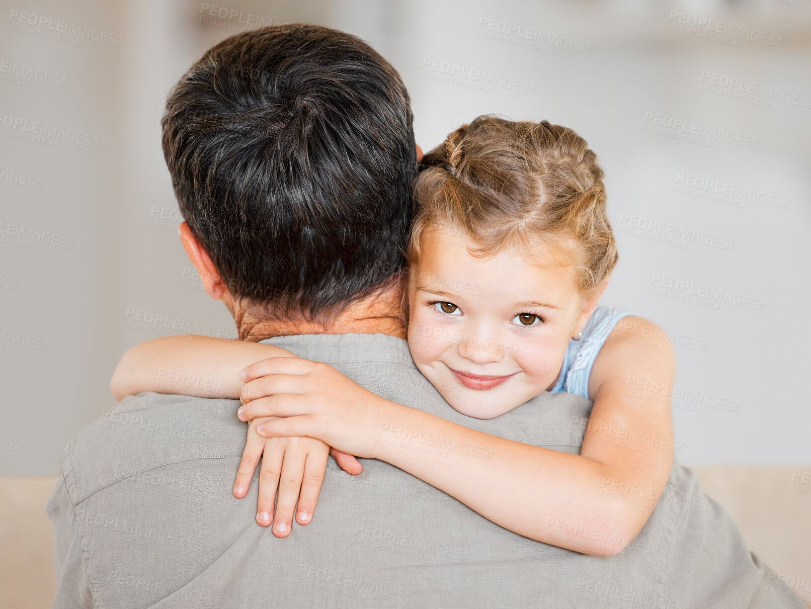 Buy stock photo Happy, hug and child with father with care, love and bonding together in home living room. Portrait, family and dad with little girl, affection and greeting for childhood comfort and smile in house